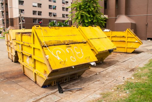 Exterior view of commercial waste bins in Cobham area with clear signage