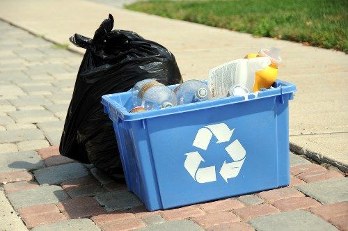 Workers sorting commercial rubbish into bins
